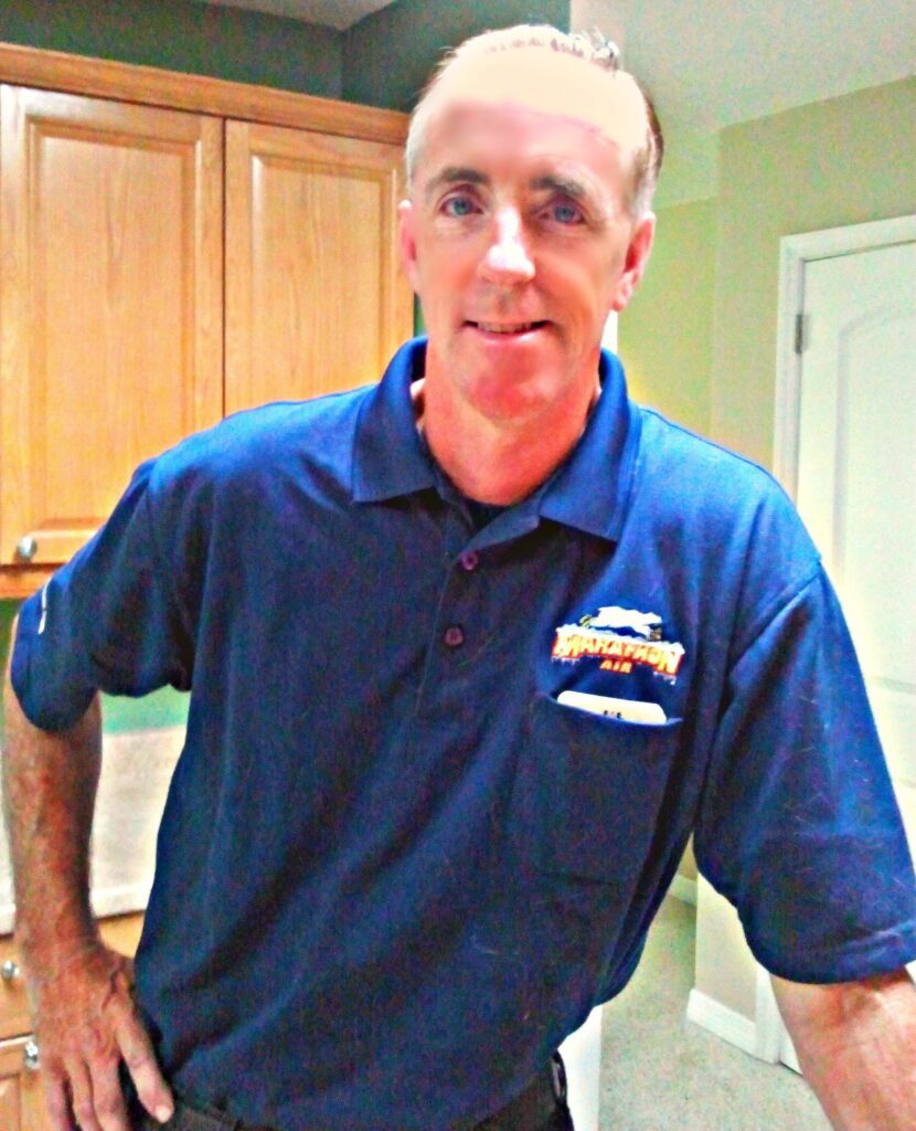 commercial air repair expert, John Schutz, getting ready to go to work